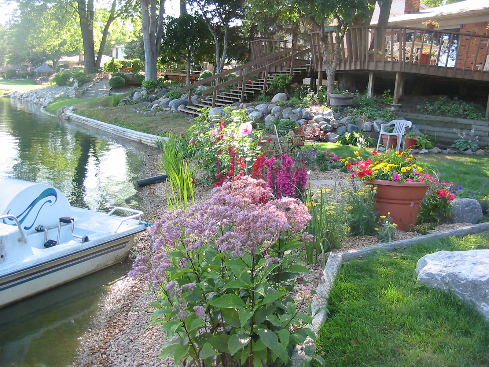 Lakeside garden with layered flowering plantings